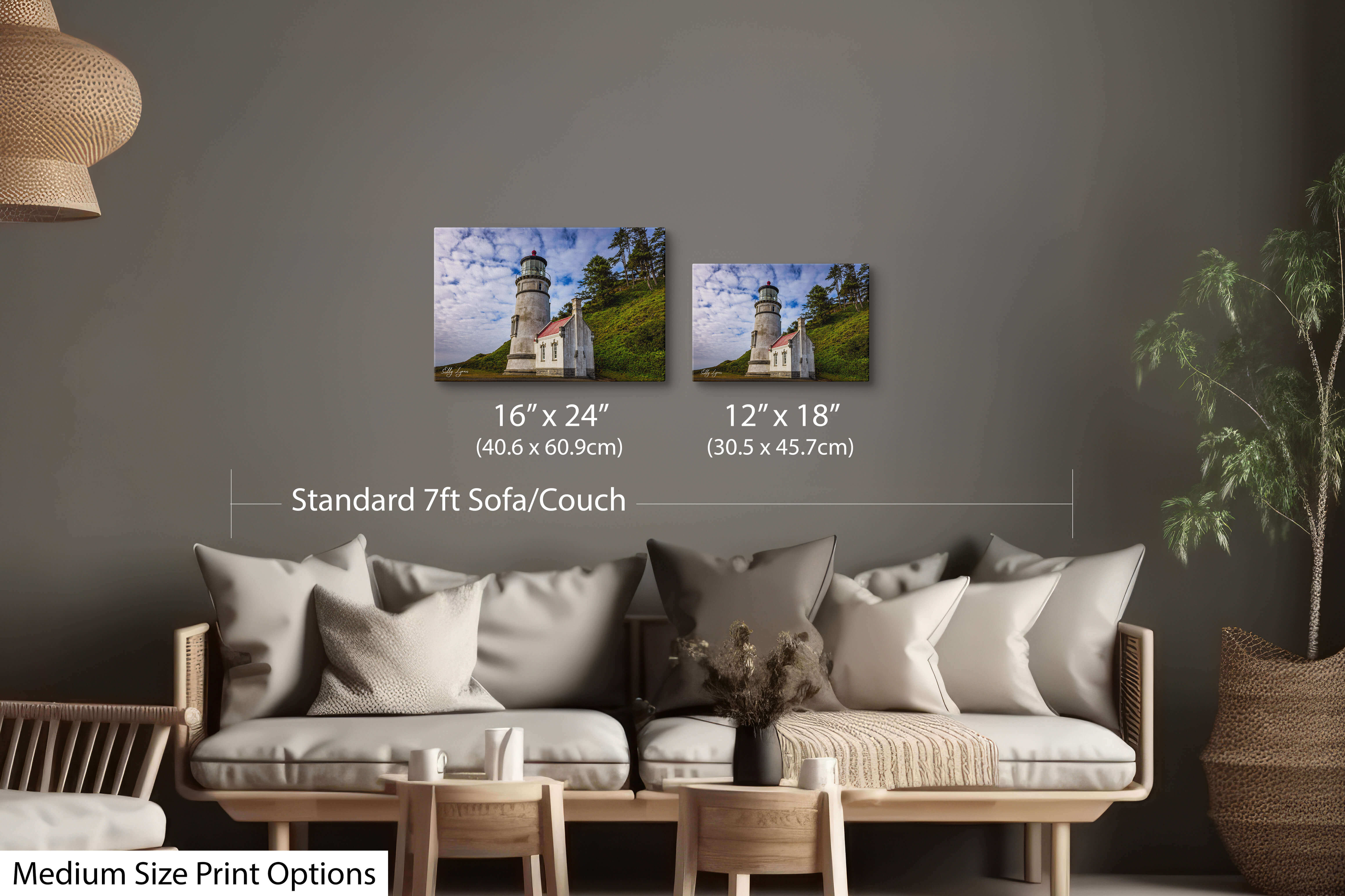 Two matching medium-sized prints of lighthouse and ocean views on a living room wall.