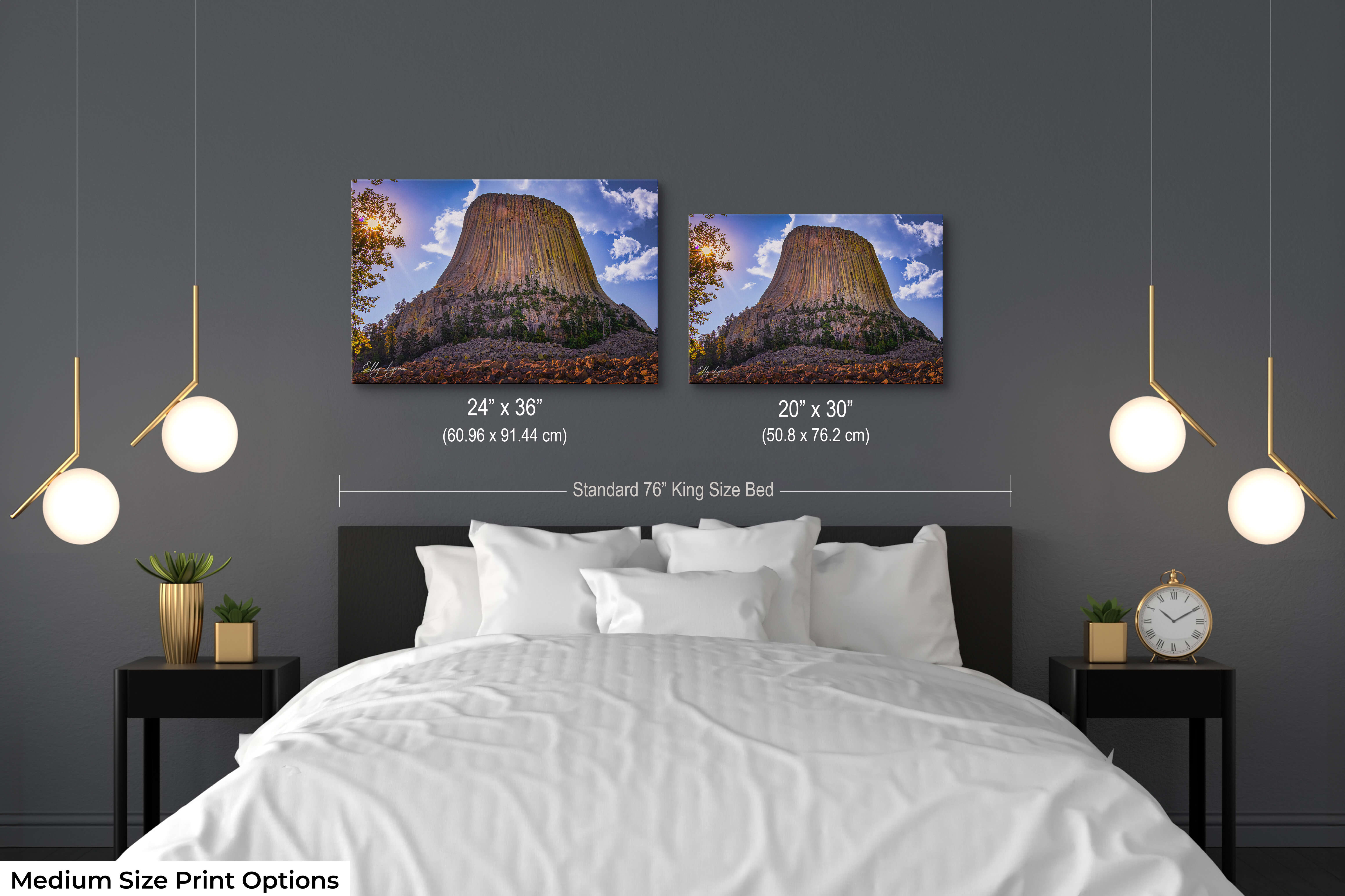 Medium size Devil’s Tower art print with golden light in 20x30 and 24x36 formats above a modern king-size bed for proportion reference.