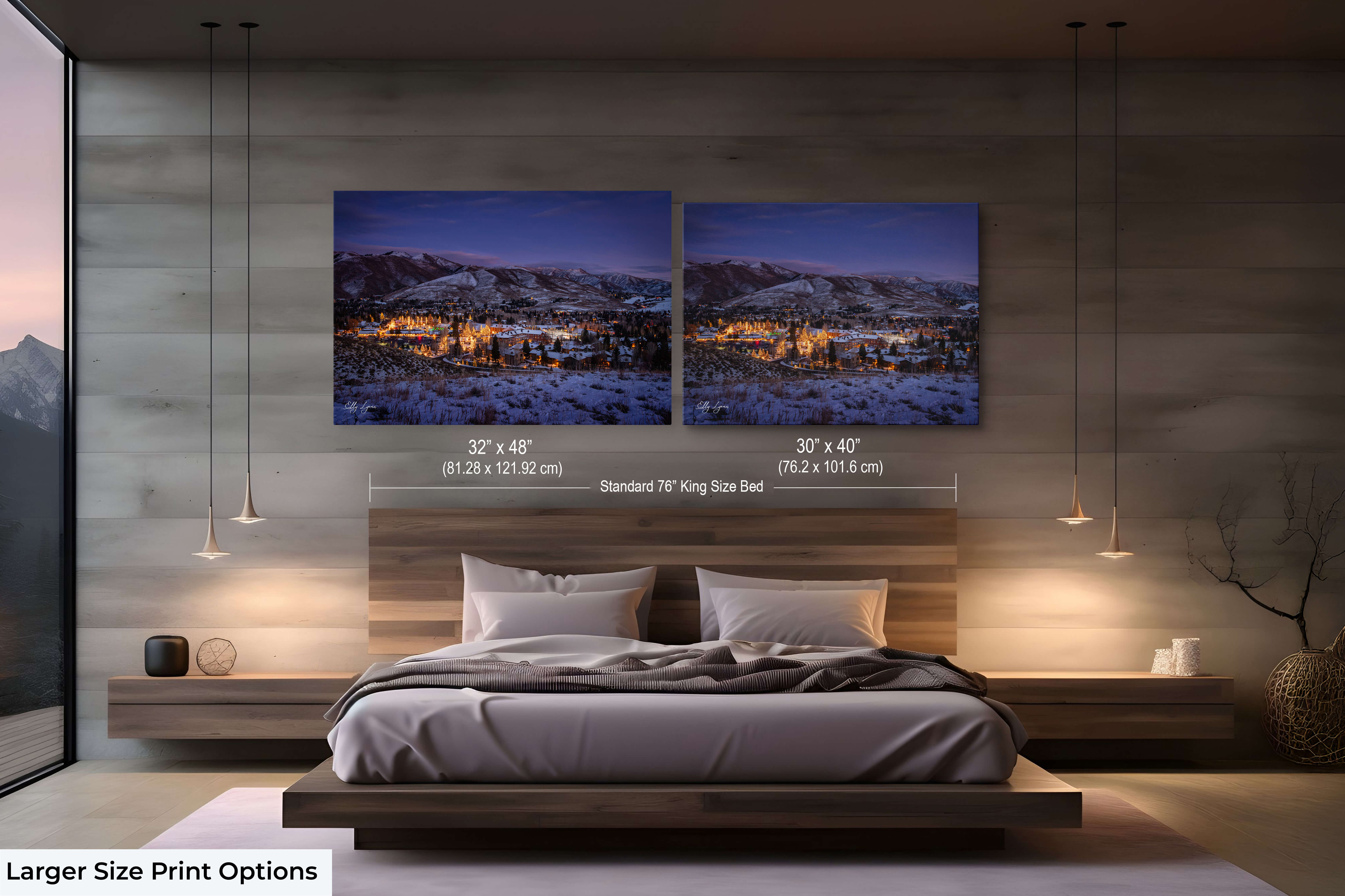 Large serene winter town print in a softly lit bedroom.