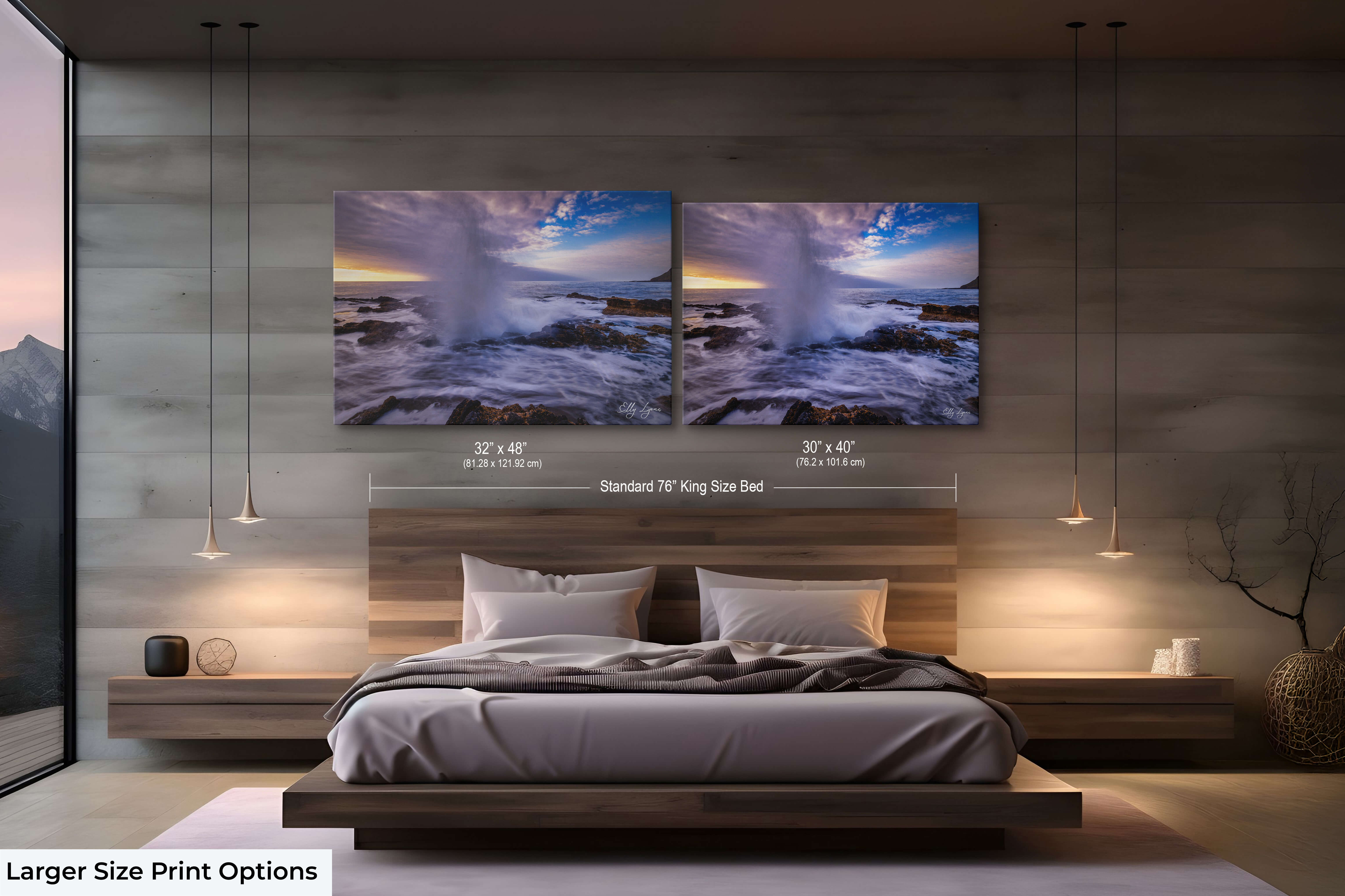 Large framed blowhole print paired with moody ocean tones for coastal bedroom decor.