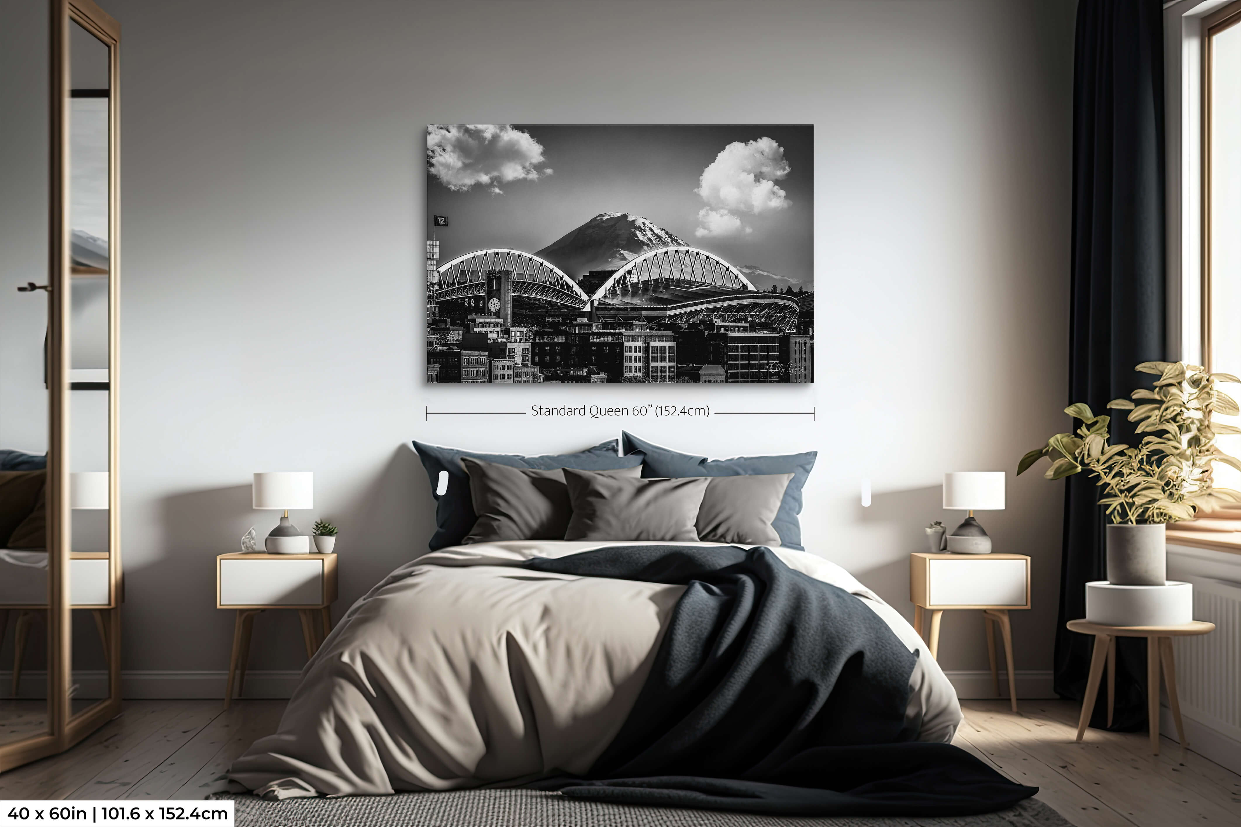 Single-panel 40x60 black and white print of Lumen Field and Mt. Rainier above a queen bed, highlighting scale and mood.
