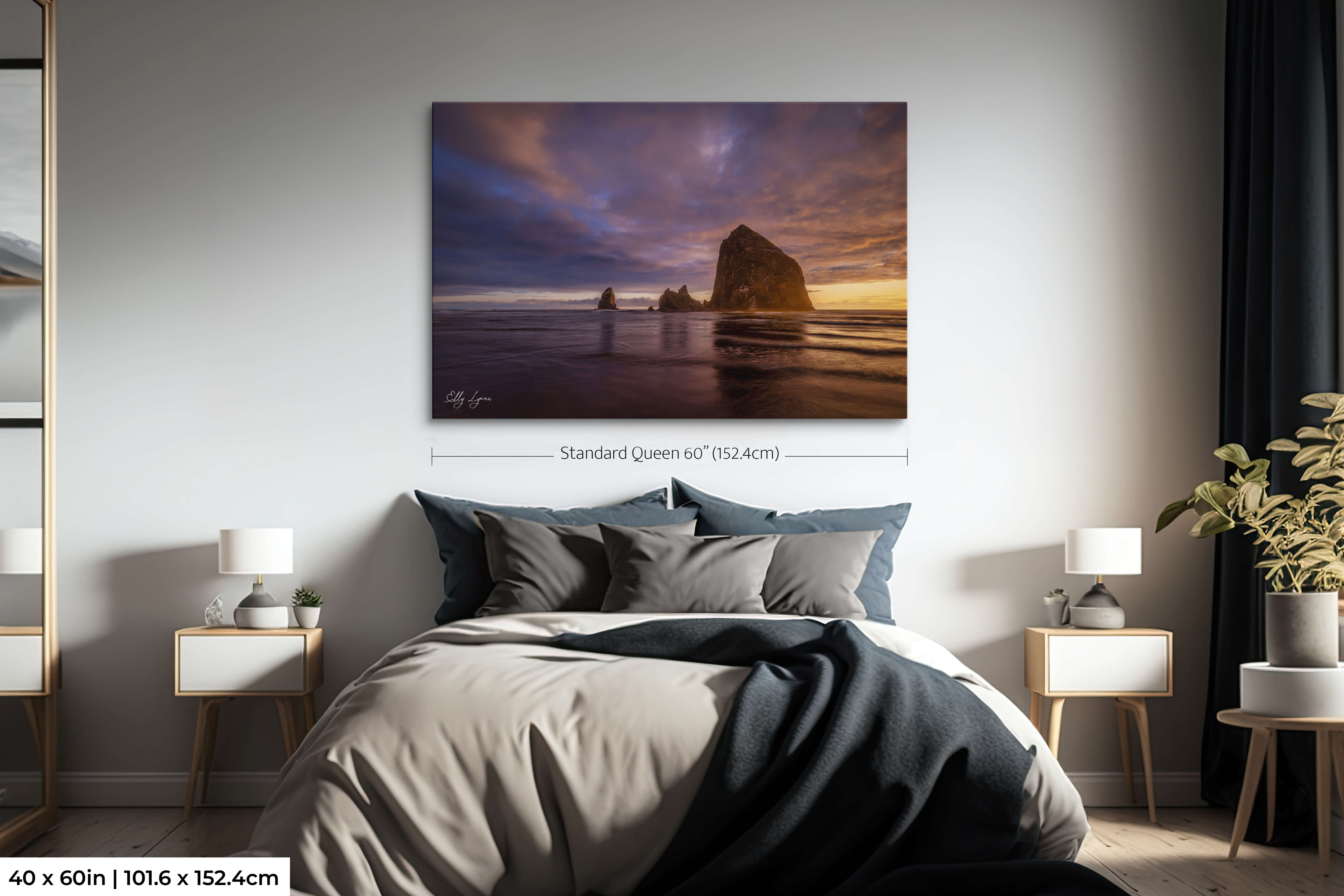 Oversized Haystack Rock sunset wall art as a statement piece above the bed.