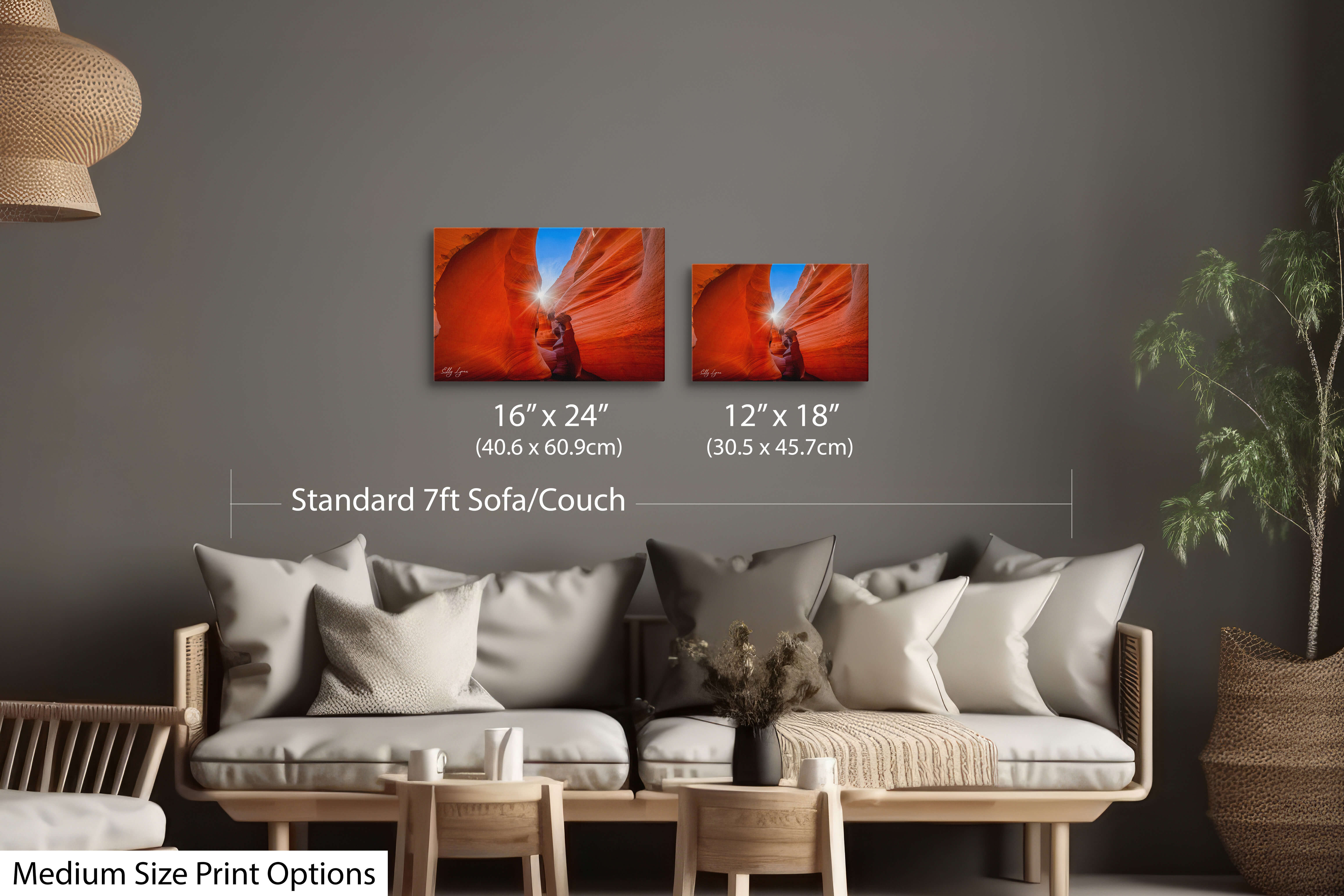 Antelope Canyon sunburst print displayed in 2 different print sizes of 12 by 18 inches and 16 by 24 inches styled over a standard couch/sofa showcasing size comparison and scale.