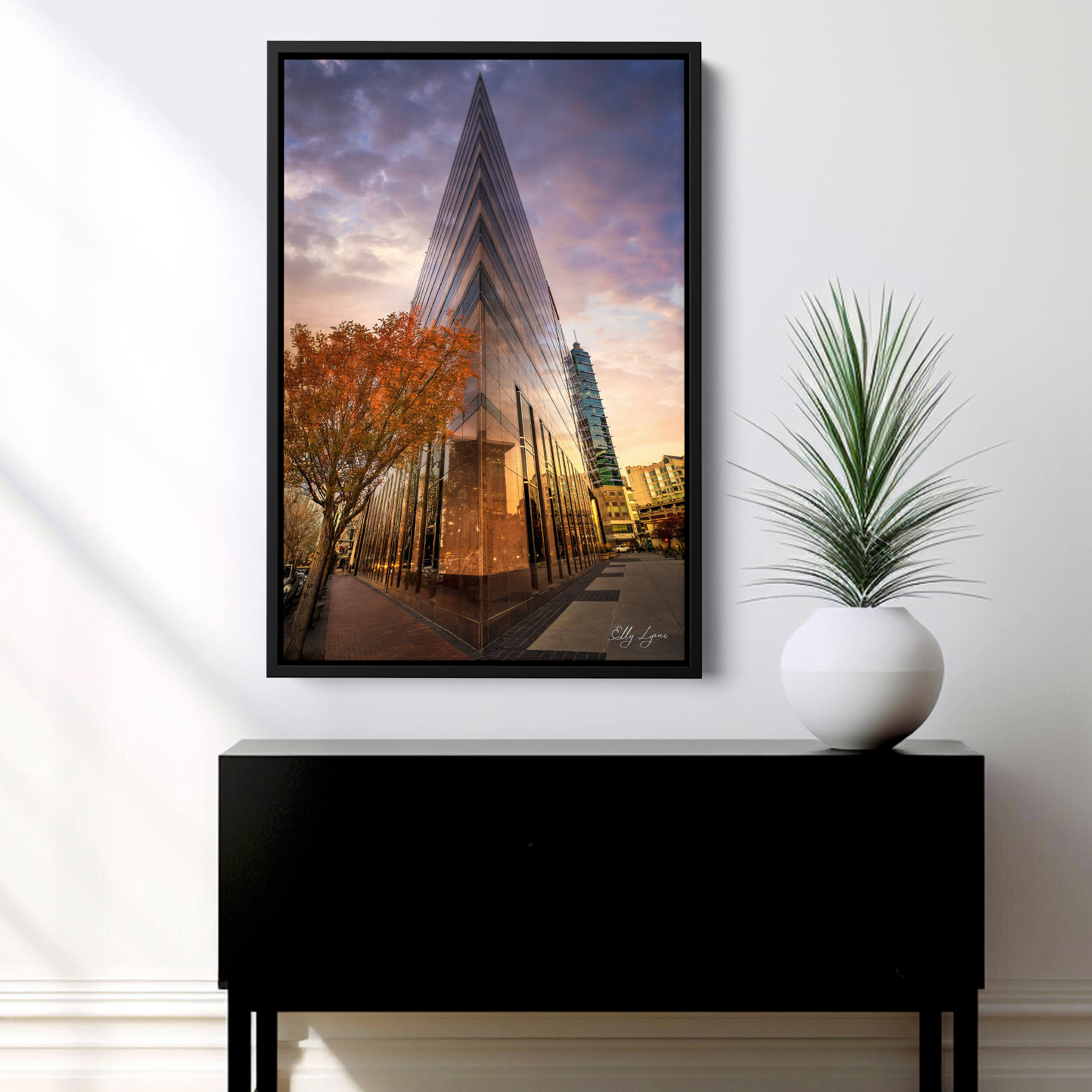 Wells Fargo Building ine art photograph at sunsetwith a dramatic triangular perspective and autumn trees reflecting off the glass like tiles.