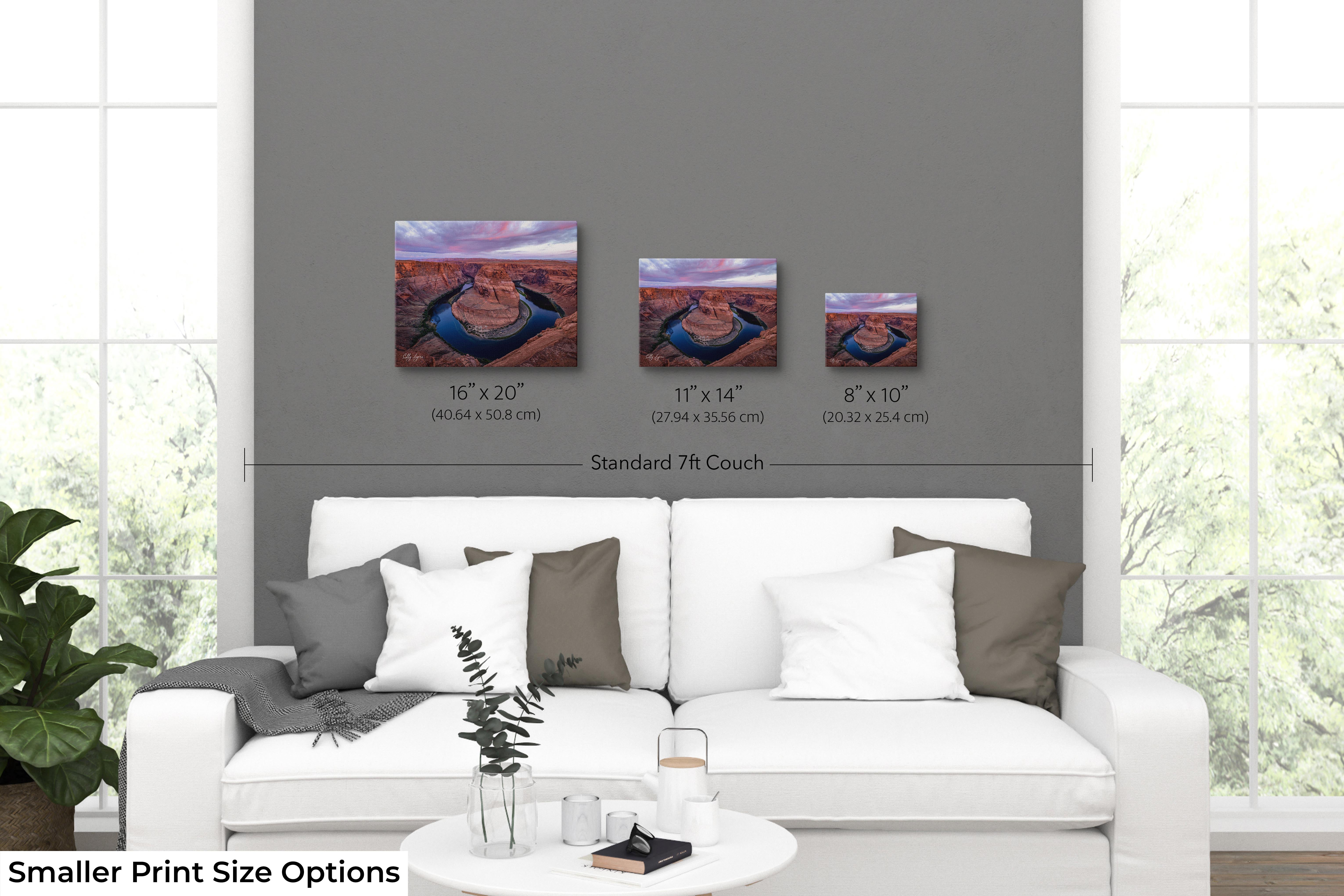 Horseshoe Bend sunrise, Colorado River print size comparison in living room showing 8x10, 11x14, and 16x20 wall art options.
