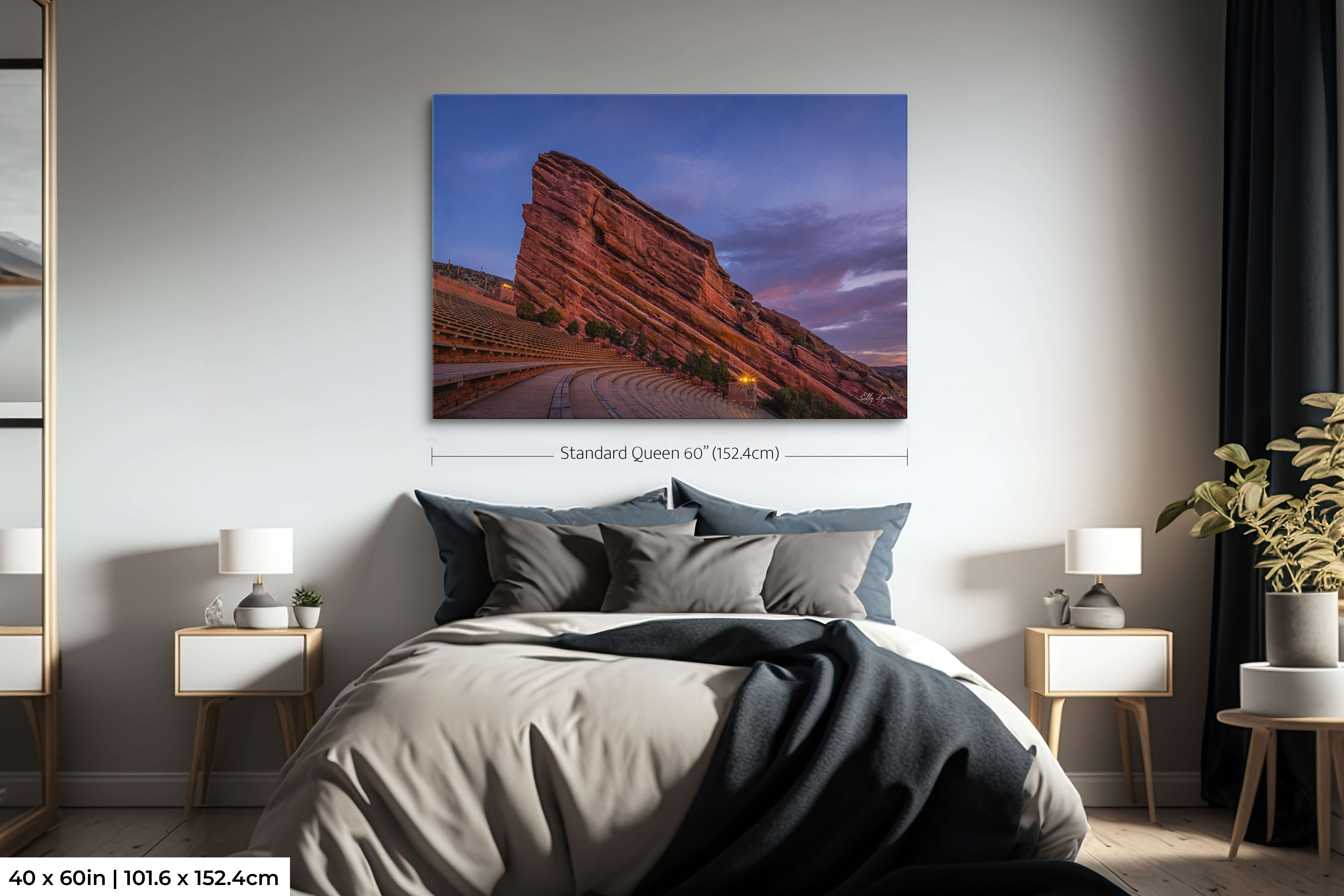 Red Rocks Amphitheater fine art print in 40x60 size above queen bed in cozy bedroom, showing scale.